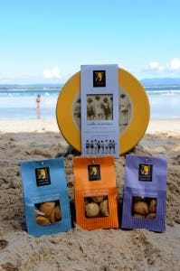 Byron Bay Cookie Company products on the beach